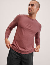 pink long sleeve crewneck top.